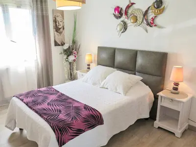 Un ou plusieurs lits dans un hébergement de l'établissement Holiday Home Les Camélias by Interhome