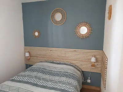Un ou plusieurs lits dans un hébergement de l'établissement Appartement vue port