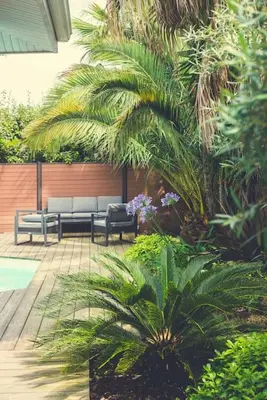Jardin de l'établissement Villa proche du bassin -piscine