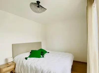 Un ou plusieurs lits dans un hébergement de l'établissement Maison de vacances à 5 minutes de l'océan et des commerces