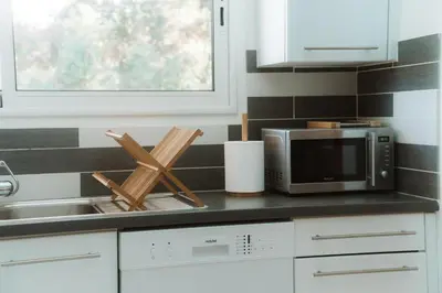 Cuisine ou kitchenette dans l'établissement Maison du Parc - Vue canal