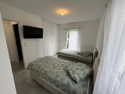 Un ou plusieurs lits dans un hébergement de l'établissement Appartement Biscarrosse
