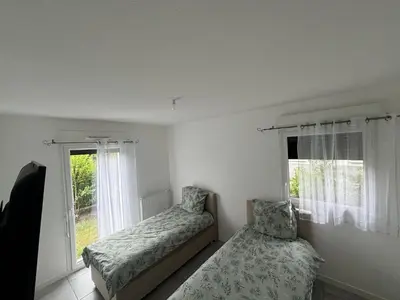Un ou plusieurs lits dans un hébergement de l'établissement Appartement Biscarrosse