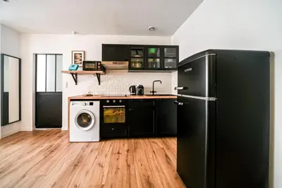 Cuisine ou kitchenette dans l'établissement L'Atelier de la Madeleine - Dax