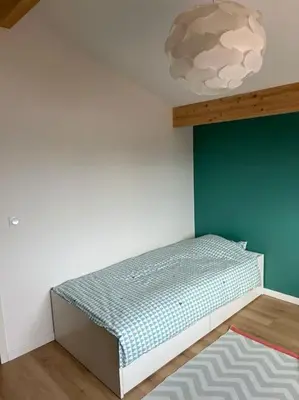 Un ou plusieurs lits dans un hébergement de l'établissement Maison proche océan à tosse