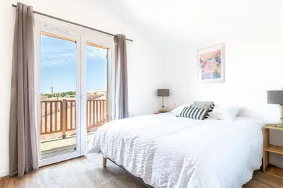 Un ou plusieurs lits dans un hébergement de l'établissement Appartement à 200 m de la plage