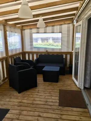 Coin salon dans l'établissement Mobilhome neuf au camping La Réserve