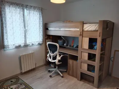 Un ou plusieurs lits dans un hébergement de l'établissement Maison 120 m2, piscine chauffée, en bordure de forêt