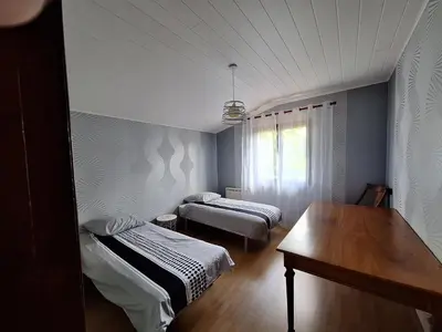 Un ou plusieurs lits dans un hébergement de l'établissement Maison à 20 min des plages Landaises