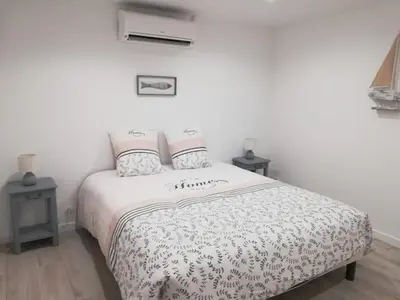 Un ou plusieurs lits dans un hébergement de l'établissement Jolie Maisonnette de 37 m2 meublée