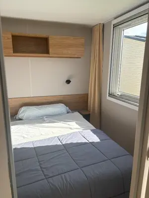 Un ou plusieurs lits dans un hébergement de l'établissement Mobilhome 8 personnes au bord de l'Océan