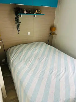 Un ou plusieurs lits dans un hébergement de l'établissement MH 142B Camping 