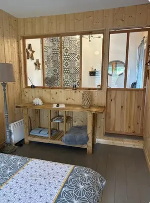 Un ou plusieurs lits dans un hébergement de l'établissement Le chalet du bonheur