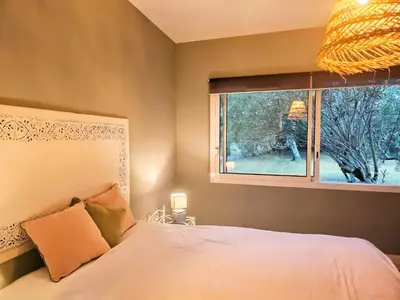 Un ou plusieurs lits dans un hébergement de l'établissement Chambre d'hôtes Landes - Le Clos des Oliviers