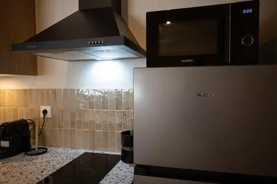 Cuisine ou kitchenette dans l'établissement Le Zénith - Un havre de paix à Dax