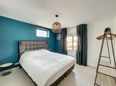 Un ou plusieurs lits dans un hébergement de l'établissement Agréable 3 chambres extra centre à 200m de l'océan
