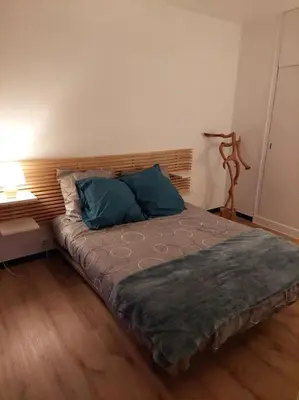 Un ou plusieurs lits dans un hébergement de l'établissement appartement spacieux et calme avec plages à 15 min