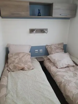 Un ou plusieurs lits dans un hébergement de l'établissement Mobilhome climatisé 6 pers