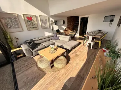 Coin salon dans l'établissement Appartement face à l'océan Chez Tao