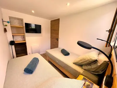 Un ou plusieurs lits dans un hébergement de l'établissement Appartement face à l'océan Chez Tao