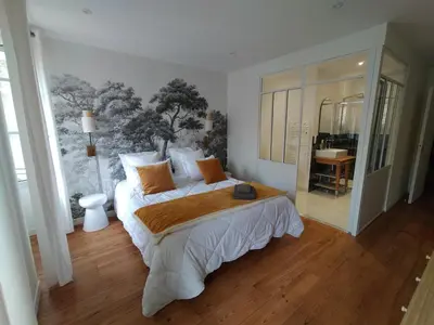 Un ou plusieurs lits dans un hébergement de l'établissement chambres d'hôtes numéro 2 Le Bedat côté jardin