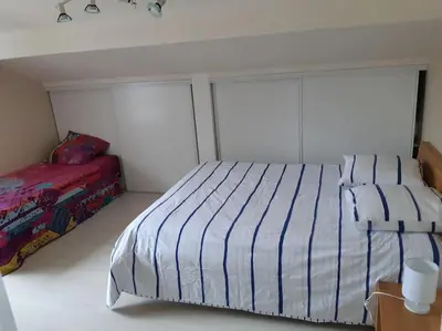 Un ou plusieurs lits dans un hébergement de l'établissement Villa Ocean's four