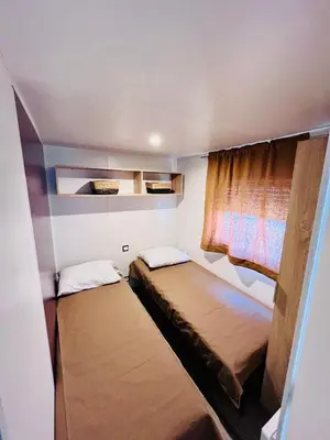 Un ou plusieurs lits dans un hébergement de l'établissement Nature océan mobil-home