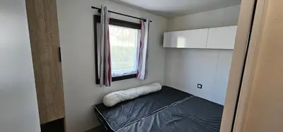Un ou plusieurs lits dans un hébergement de l'établissement Location Mobilhome 3ch Mimizan Plage