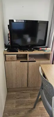 Télévision ou salle de divertissement dans l'établissement Location Mobilhome 3ch Mimizan Plage