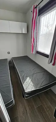 Un ou plusieurs lits dans un hébergement de l'établissement Location Mobilhome 3ch Mimizan Plage