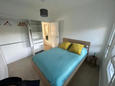 Un ou plusieurs lits dans un hébergement de l'établissement Appartement rez-de-chaussée