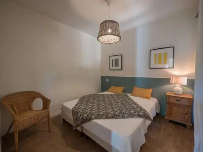 Un ou plusieurs lits dans un hébergement de l'établissement Villa Les Violettes à deux pas de la plage PYLA SUR MER