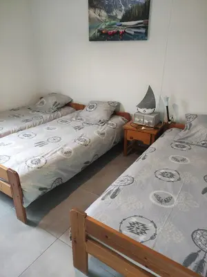 Un ou plusieurs lits dans un hébergement de l'établissement Villa jendy