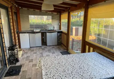 Cuisine ou kitchenette dans l'établissement Location Mobilhome Bahiana 8 personnes Camping 4 étoiles La Réserve Gastes