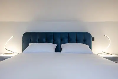 Un ou plusieurs lits dans un hébergement de l'établissement Appartement moderne avec parking