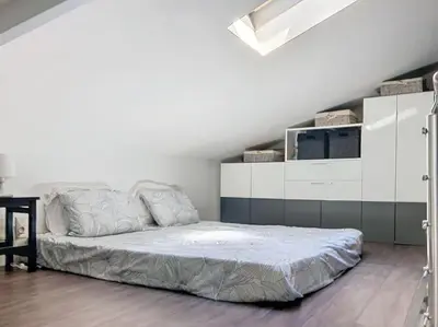 Un ou plusieurs lits dans un hébergement de l'établissement Appartement proche de la plage
