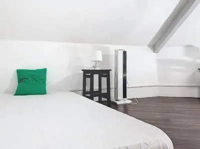 Un ou plusieurs lits dans un hébergement de l'établissement Appartement proche de la plage