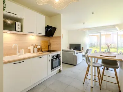 Cuisine ou kitchenette dans l'établissement Appart cosy sunset
