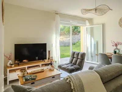 Télévision ou salle de divertissement dans l'établissement Appart cosy sunset