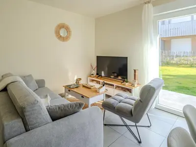 Télévision ou salle de divertissement dans l'établissement Appart cosy sunset
