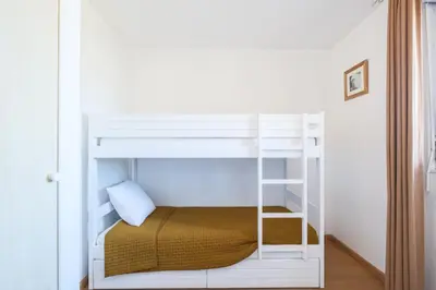 Un ou plusieurs lits dans un hébergement de l'établissement Appartement aux Cottages du Lac H70