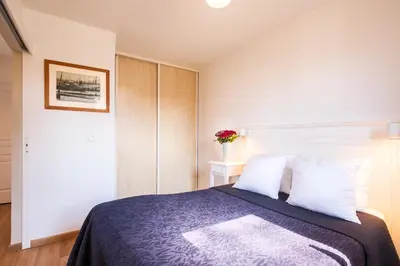 Un ou plusieurs lits dans un hébergement de l'établissement Appartement aux Cottages du Lac H70