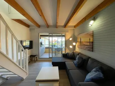 Coin salon dans l'établissement Duplex T2 avec Piscine à Capbreton proche Plage - FR-1-413-250
