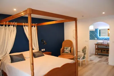 Un ou plusieurs lits dans un hébergement de l'établissement Chambres d'hotes Les sables Blancs