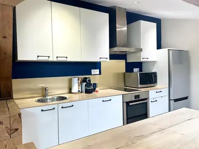 Cuisine ou kitchenette dans l'établissement Le Nid Douillet - Clim - Fibre - Chaleureux - Lumineux