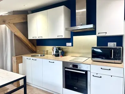 Cuisine ou kitchenette dans l'établissement Le Nid Douillet - Clim - Fibre - Chaleureux - Lumineux