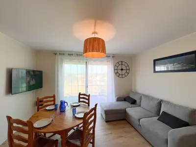 Coin salon dans l'établissement Appartement familial proche des plages