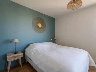 Un ou plusieurs lits dans un hébergement de l'établissement Maison neuve proche océan, terrasse, parking, 8 pers - FR-1-319-585