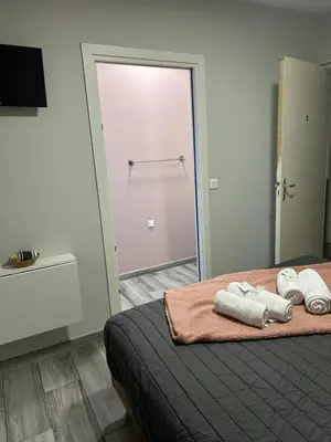 Un ou plusieurs lits dans un hébergement de l'établissement Hôtel Le MerleBlanc
