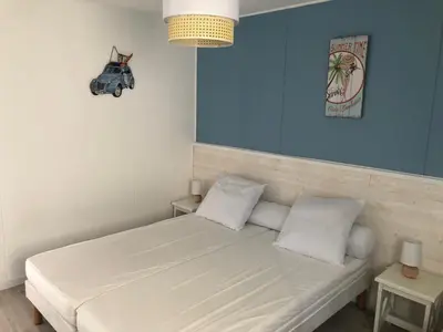 Un ou plusieurs lits dans un hébergement de l'établissement Charmante maisonette